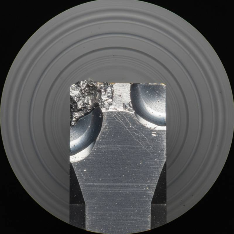 Microscopic view of tool wear on a carbide insert
